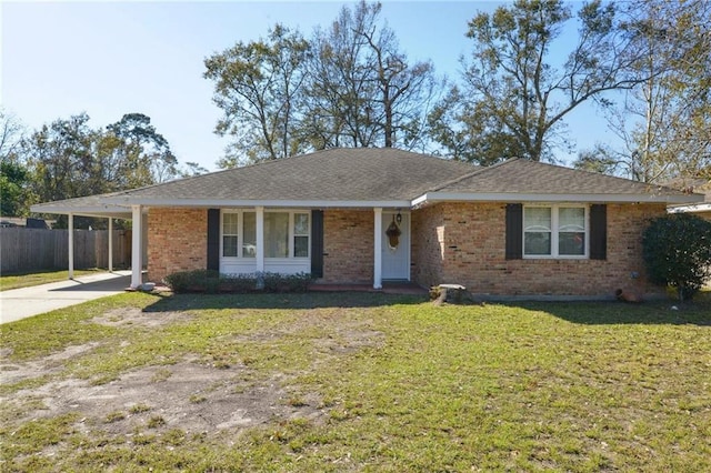 single story home with a front lawn and a carport