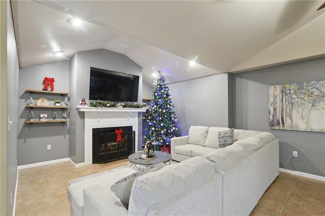 living room featuring light tile patterned floors and vaulted ceiling