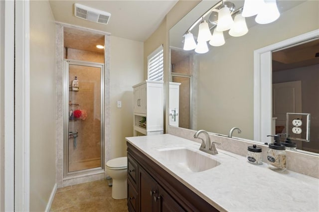 bathroom with an inviting chandelier, vanity, an enclosed shower, and toilet