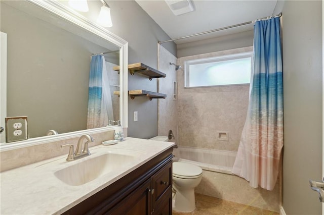 full bathroom with tile patterned flooring, vanity, toilet, and shower / bath combo with shower curtain