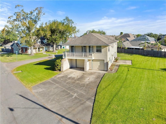 view of front of property with a front yard and a garage