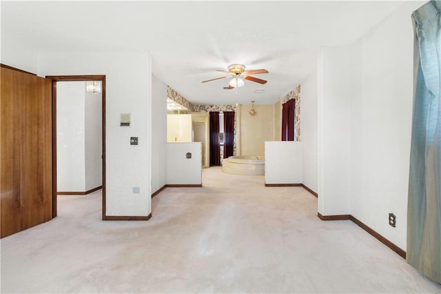 empty room with light carpet and ceiling fan