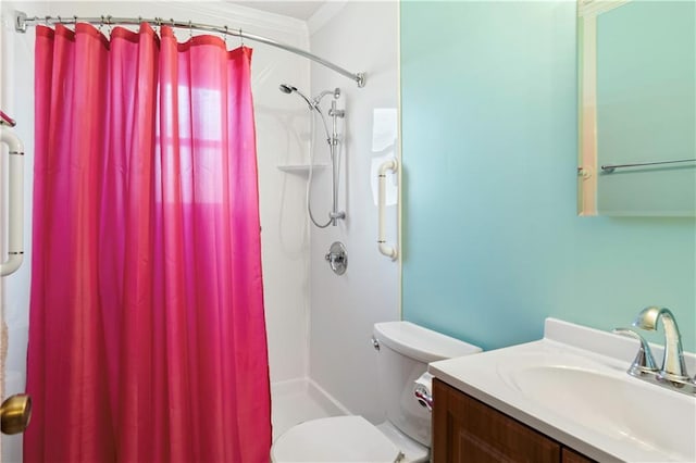 bathroom featuring curtained shower, vanity, and toilet