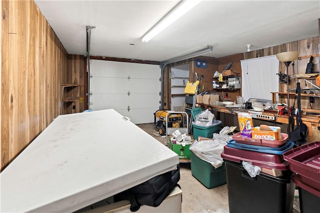 garage featuring wood walls