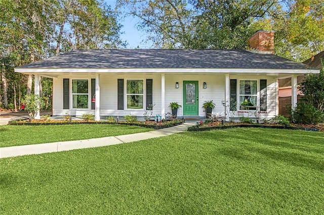 ranch-style house with covered porch and a front yard