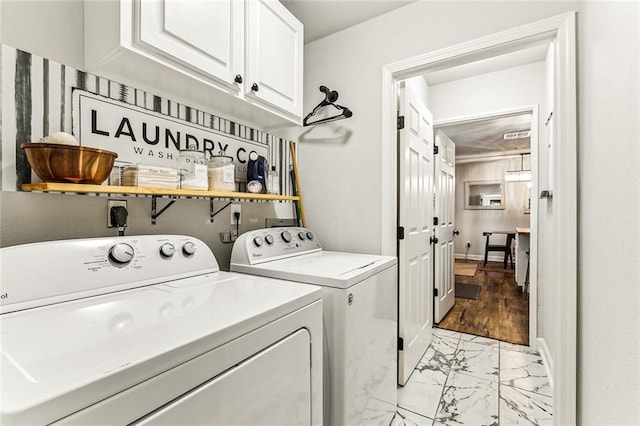 laundry area with cabinets and washer and dryer