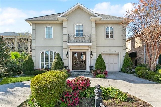 view of front of home featuring french doors and a garage