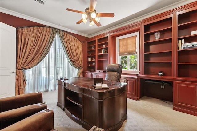 home office featuring light carpet, ceiling fan, and ornamental molding