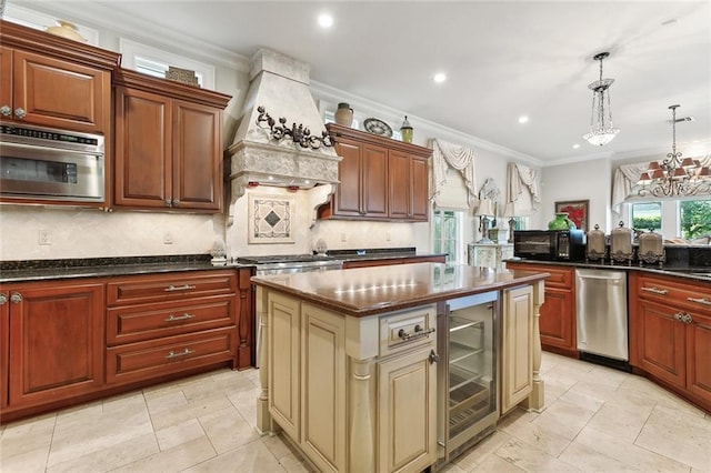 kitchen with pendant lighting, backsplash, an inviting chandelier, wine cooler, and appliances with stainless steel finishes