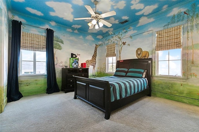 carpeted bedroom featuring multiple windows and ceiling fan