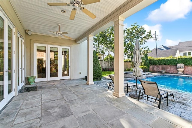 view of patio / terrace featuring french doors, a fenced in pool, and ceiling fan