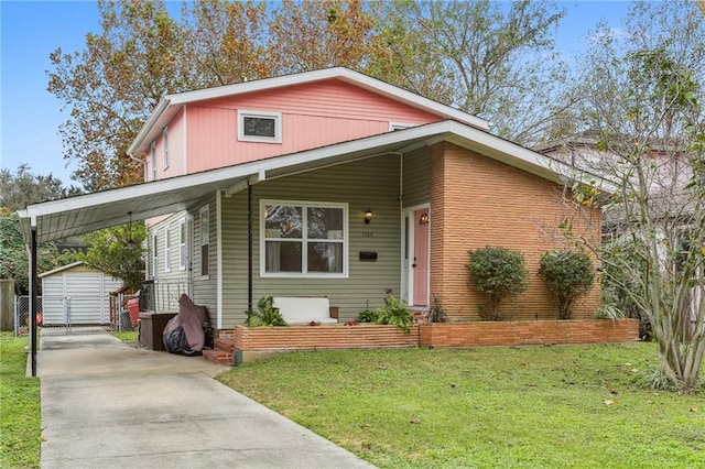 view of front facade featuring a carport, a storage shed, and a front lawn