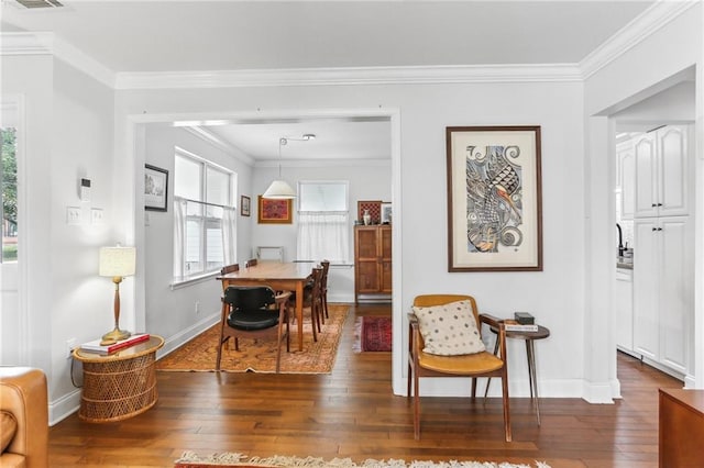 interior space featuring dark hardwood / wood-style flooring and ornamental molding