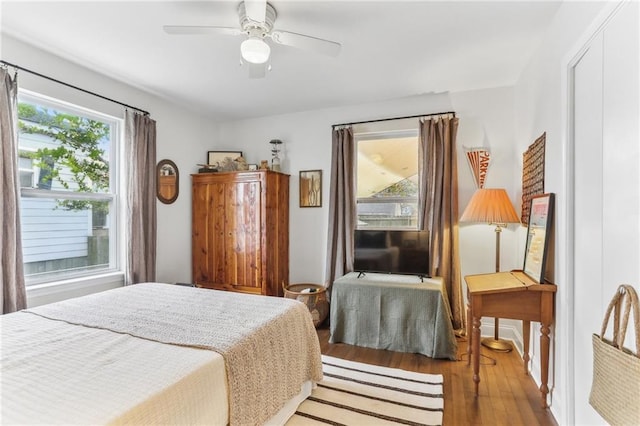 bedroom featuring ceiling fan and light hardwood / wood-style floors