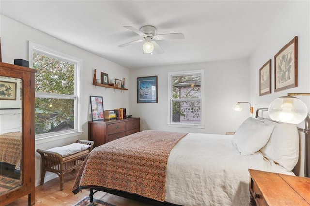 bedroom featuring hardwood / wood-style flooring and ceiling fan