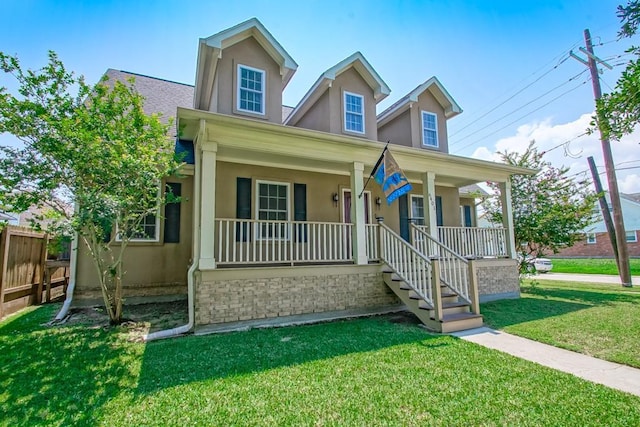 view of front of property featuring a porch and a front yard