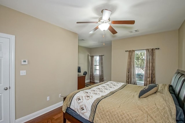 bedroom with ceiling fan and wood-type flooring