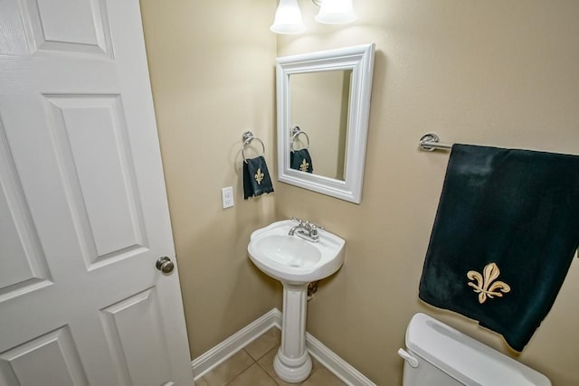 bathroom with tile patterned flooring and toilet