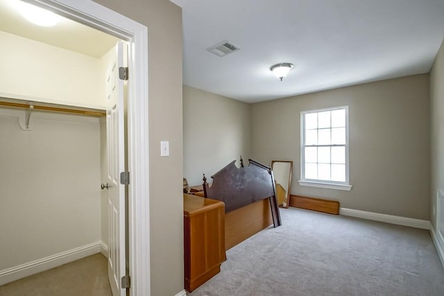 carpeted bedroom with a closet