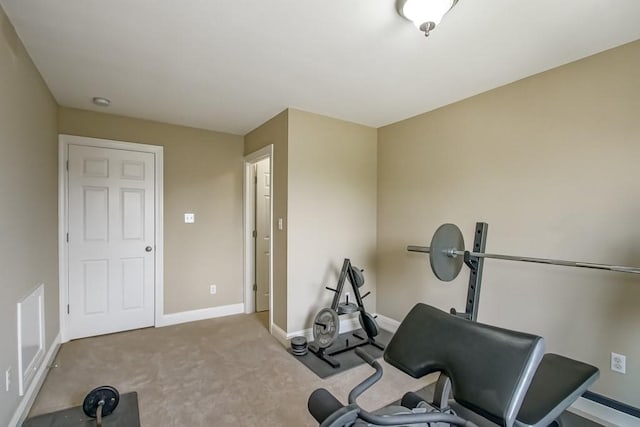 exercise room with light carpet