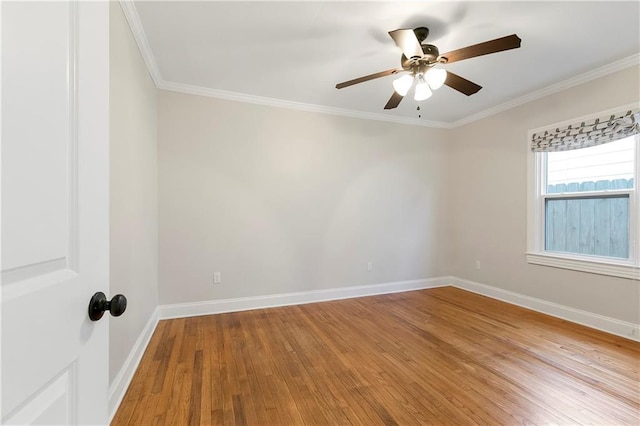 spare room with light hardwood / wood-style flooring, ceiling fan, and crown molding