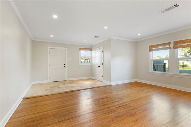 interior space featuring light hardwood / wood-style floors and ornamental molding