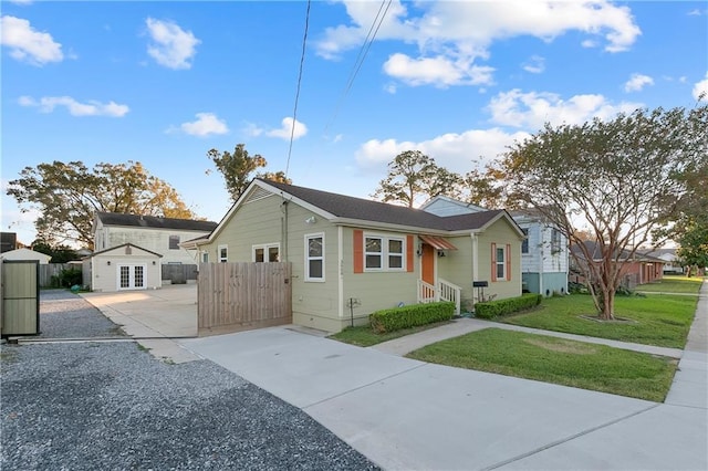 bungalow-style home featuring a front yard