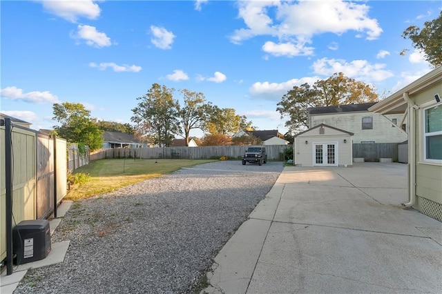 view of yard featuring french doors and a patio area