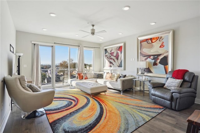 living room with hardwood / wood-style floors and ceiling fan