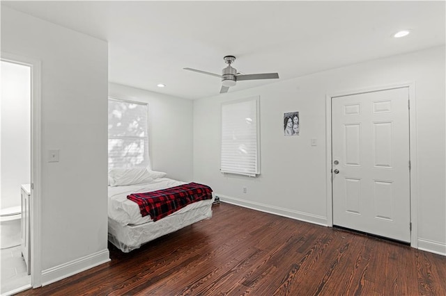 bedroom featuring ceiling fan and dark hardwood / wood-style flooring