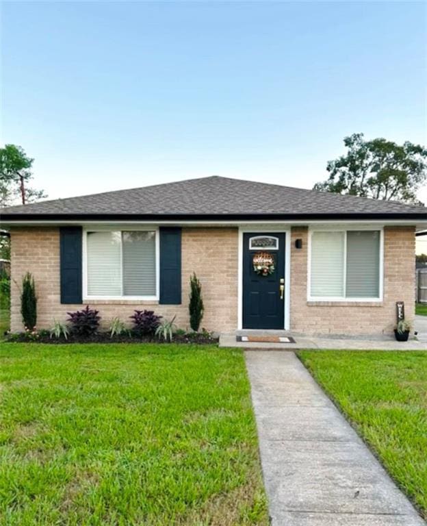 2221 Riverbend Dr, Violet, LA 70092 - ranch-style house featuring a front yard