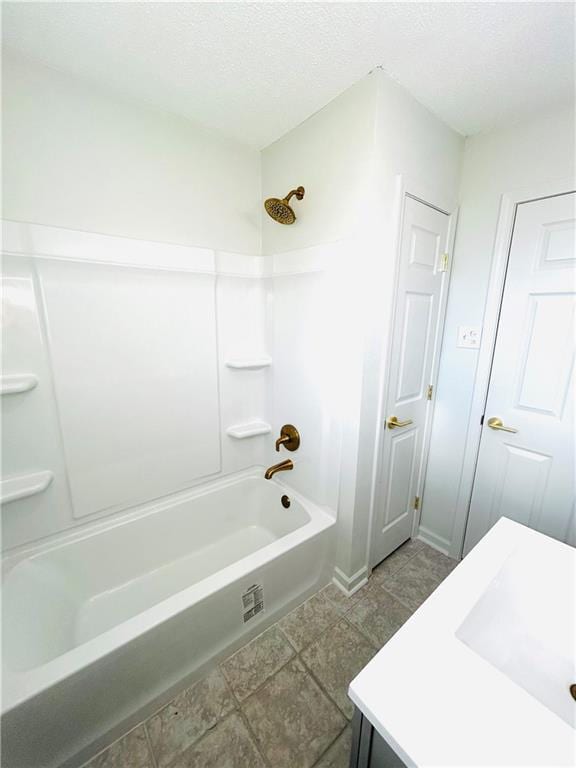 bathroom featuring shower / washtub combination and sink