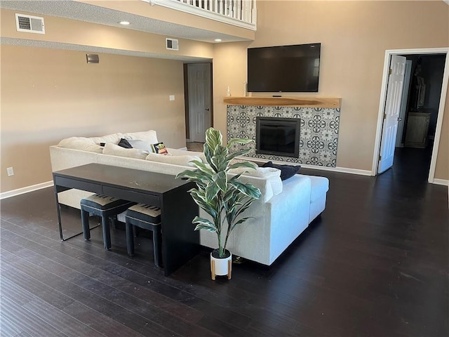 living room with dark hardwood / wood-style floors