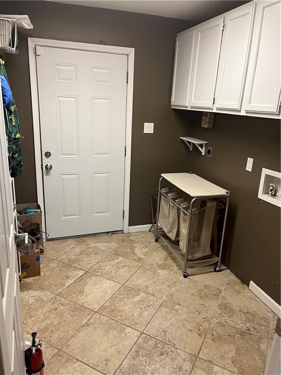 laundry room with cabinets and hookup for a washing machine