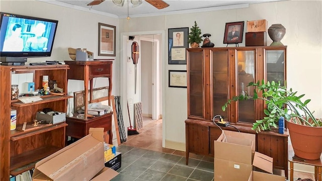 misc room featuring ceiling fan and ornamental molding