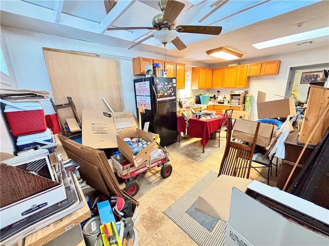 interior space with ceiling fan