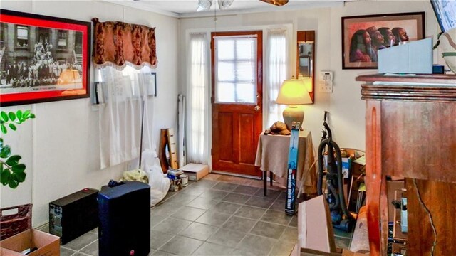 entrance foyer with ceiling fan