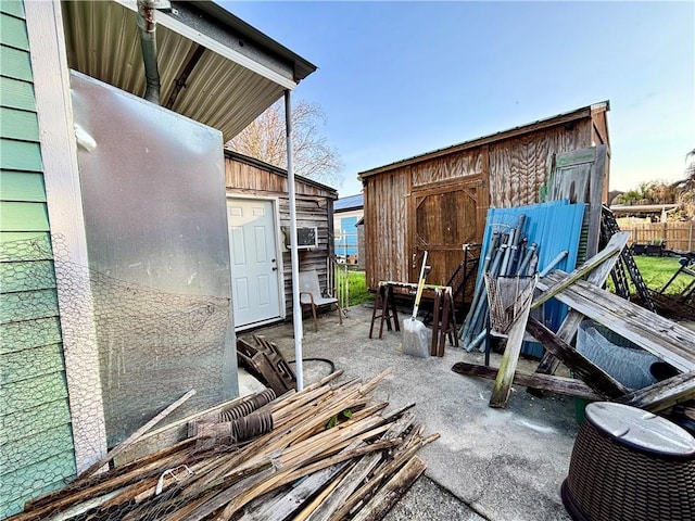 view of patio / terrace with a shed