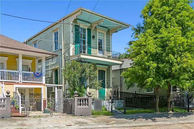 view of front of house featuring a balcony