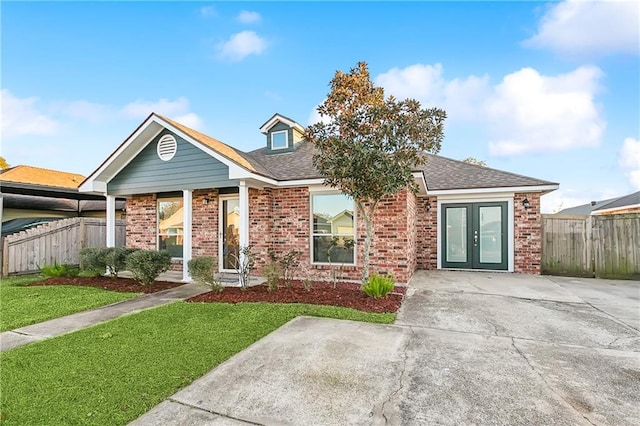 view of front of home featuring french doors and a front lawn