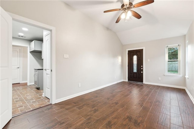 foyer featuring ceiling fan and vaulted ceiling