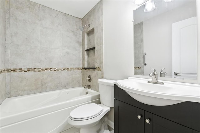 full bathroom with tiled shower / bath combo, toilet, and vanity