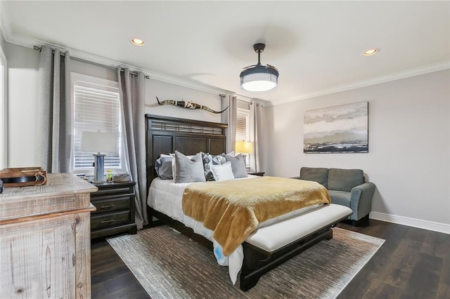 bedroom with crown molding and dark hardwood / wood-style flooring