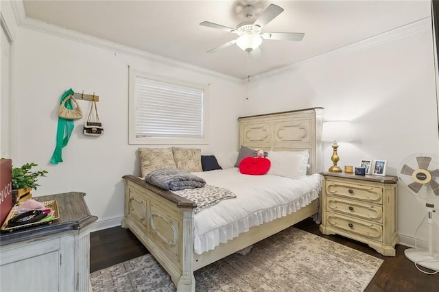 bedroom with ceiling fan, dark hardwood / wood-style floors, and ornamental molding