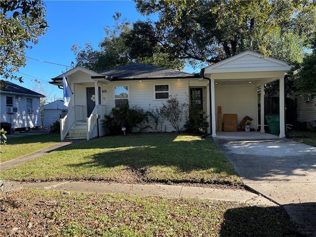 view of front of house with a carport, cooling unit, and a front lawn