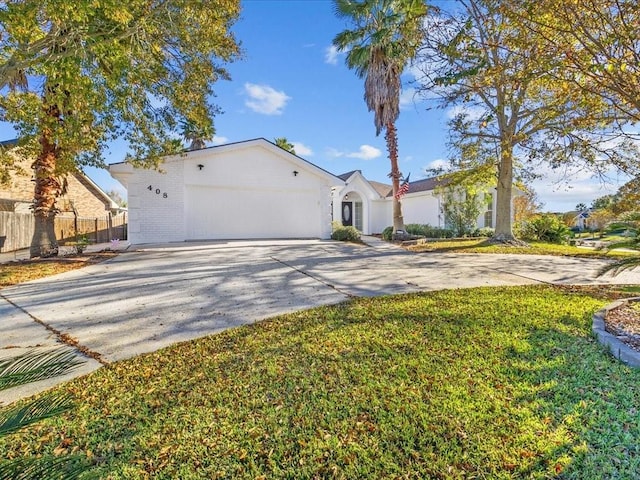 view of front of property with a garage and a front yard