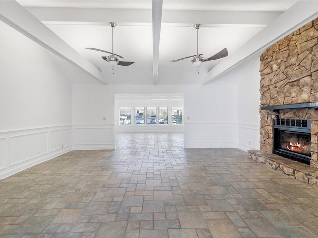 unfurnished living room featuring lofted ceiling and a fireplace