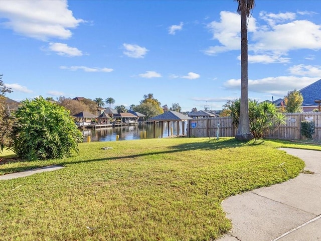 view of yard featuring a gazebo and a water view