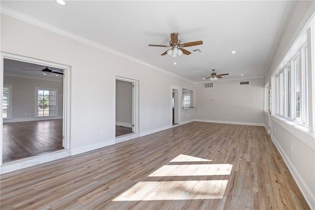 unfurnished living room featuring ceiling fan, light hardwood / wood-style floors, and crown molding