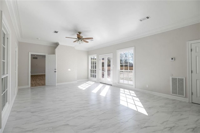 spare room with ceiling fan and crown molding